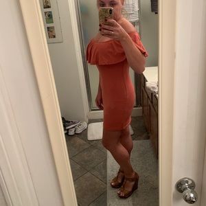 Rose-pink, form-fitting, off-the-shoulder dress